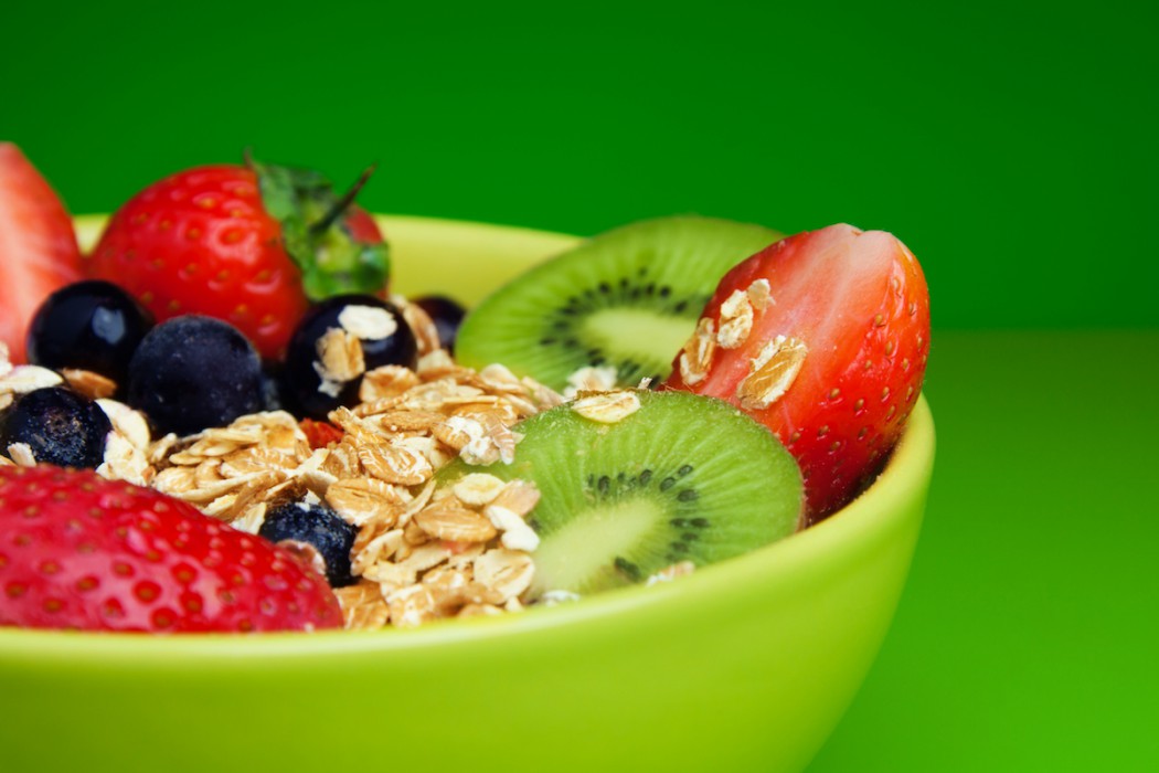 Bowl with muesli and fresh berries and fruits